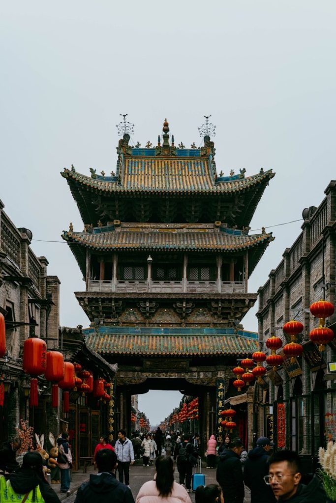 Traditional chinese architecture with red lanterns and people